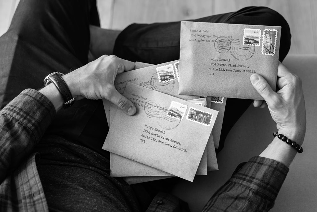 person holding mails